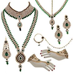 an assortment of green and white jewelry on display