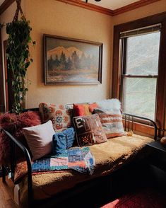 a living room filled with lots of pillows