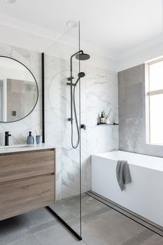 a bathroom with a sink, mirror and bathtub