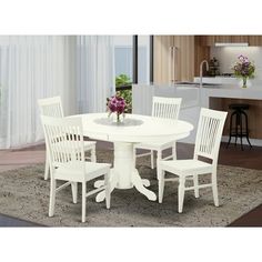 a white table with four chairs around it