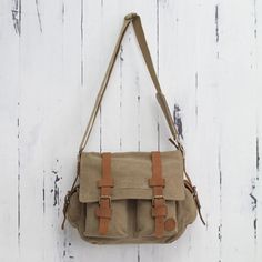 Tan and Brown Leather Accent Roomy Canvas Messenger Bag - Journey to Puno | NOVICA #handmadewithlove #readysettakeoff #supportartisans #handmade Cheap Khaki Canvas Satchel Bag, Affordable Vintage Canvas Satchel, Affordable Khaki Canvas Satchel Bag, Cheap Light Brown Bag With Adjustable Strap, Affordable Brown Vintage Canvas Bag, Cheap Brown Satchel With Zipper Pocket, Cheap Brown Chest Bag With Pockets, Cheap Light Brown Satchel Bag, Casual Light Brown Cheap Satchel