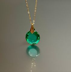 Gorgeous Colombian emerald necklace. The oval shape facet pendant is eye-clean and has a beautiful ocean green color. The ultra-fine pendant has great clarity and reflects lights beautifully and attached to a gold-filled bail and is suspended on a 14k gold fill chain. The necklace is elegant and has a lux look. * AAA+ Flawless Flawless Colombian emerald * Pendant size (with the bail): 30x18 mm * Metal: 14K gold-filled/Sterling Silver * Necklace length : 46 cm / 18 inc Solid gold, 14K gold-filled Custom Round Gemstone Necklace Fine Jewelry, Custom Round Gemstone Necklace In Fine Jewelry Style, Round Custom Gemstone Necklace In Fine Jewelry Style, Luxury Green Oval Necklace, Luxury Oval Necklaces For May Birthstone, Exquisite Oval Gemstones For Gifts, Elegant Emerald Gemstones For Jewelry Making, Hallmarked Round Emerald Necklace, Green Round Stone Necklace For Formal Occasions