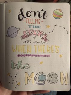 someone is holding up a notebook with some doodles on it that says don't tell me the sky is when there's the moon