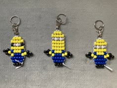 three lego keychains made to look like corn on the cob