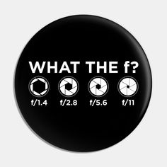 a black button with white text that says, what the f? and four different clocks