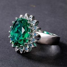 When you hold this Emerald Aquamarine Flower Ring in your hands, it's almost as though nature is right there with you. The delicately crafted Aquamarine petals are polished to a luxurious finish and the Emerald at the center complements them perfectly. This special piece of jewelry will be perfect for showcasing both sophistication and happiness on any occasion! Emerald opens and nurtures the heart and the Heart Chakra. Its soothing energy provides healing to all levels of the being, bringing fr Green Flower-shaped Jewelry For Anniversary, Green Flower Shaped Anniversary Jewelry, Green Flower-shaped Anniversary Jewelry, Emerald Flower Jewelry For Gifts, May Birthstone Flower Shaped Jewelry For Anniversary, Flower Shaped May Birthstone Jewelry For Anniversary, Sterling Silver Flower Jewelry With Center Stone, Flower Shaped May Birthstone Jewelry, Flower Shaped Jewelry With Accent Stones For Gift