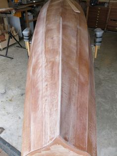 a wooden boat being built in a shop