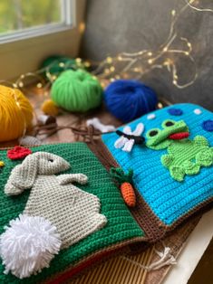 several crocheted items are sitting on a table