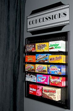 a vending machine that has some candy on it's display shelf in the corner