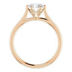 a rose gold engagement ring with an oval cut diamond