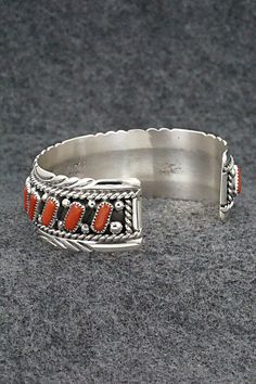 This coral and sterling silver bracelet was made by Zuni silversmith Chester Charley. The inside is signed C Charley and sterling.Size: 5 1/4" (will fit up to a 6 1/2" wrist)Gap: 1 1/4"Width: 7/8"Free shipping on all orders! We ship with USPS and always include tracking. All orders ship within a day of payment.Returns are accepted up to 30 days after you receive your order. Just send us a message. Our shop offers cash back or store credit. The item must be returned in new condition. Elegant Red Sterling Silver Cuff Bracelet, Classic Coral Jewelry As Gift, Classic Coral Jewelry Gift, Elegant Coral Sterling Silver Jewelry, Sterling Silver Bracelet, Chester, Sterling Silver Bracelets, Happy Valentines Day, Happy Valentine