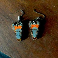 Wooden Earrings Shaped Like A Donkey Head. Donkey Is Wearing An Orange Bow. Nwot, Never Worn Wooden Donkey, Donkey Head, Donkey Jewelry, A Donkey, Orange Bows, Wooden Earrings, Earrings Color, Jewelry Earrings, Women Jewelry