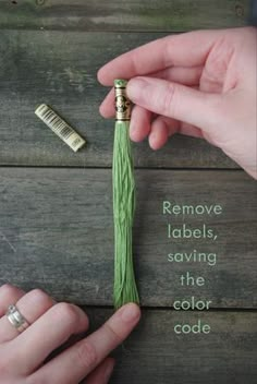 two hands are holding a green tassel with the words remove labels, saving the color code