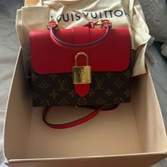 Louis Vuitton Purse Brown And Red Brand New Never Used Red Top Handle Bag With Lock, Luxury Red Bag With Lock, Red Bags With Gold-tone Hardware And Monogram Canvas, Red Bags With Gold-tone Hardware In Monogram Canvas, Red Monogram Canvas Bag With Gold-tone Hardware, Louis Vuitton Eva, Louis Vuitton Delightful, Louis Vuitton Petit Noe, Purple Louie Vuttion Purse