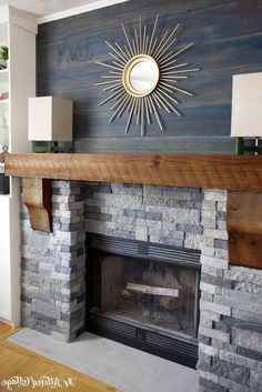 a fireplace with a mirror above it and a fire place on the wall next to it