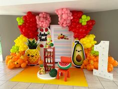 a room filled with lots of balloons and fruit