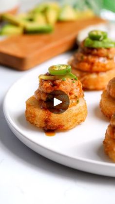 small appetizers are arranged on a white plate