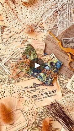 an old map with scissors and other items on it, including some paper machs