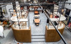 the interior of an office building with tables and chairs