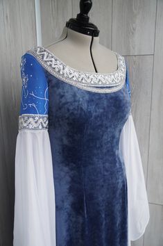 Arwen blue velvet cosplay dress from the Lord of the Rings: the Return of the King The dress is made to order! Order processing time (from placing the order to shipping) 7-14 days. Delivery usually takes about 3-6 weeks. The lace shown in photos 1-6 is not available. Please choose one of the three options shown in the last photo. Arwen Blue Dress, Fitted Gothic Medieval Dress In Blue, Fitted Blue Gothic Medieval Dress, Blue Fitted Gothic Medieval Dress, Elven Dress Lotr, Blue Fitted Medieval Dress For Cosplay, Medieval Costume Blue Dress, Arwen Cosplay, Blue Fantasy Dresses For Fantasy Events