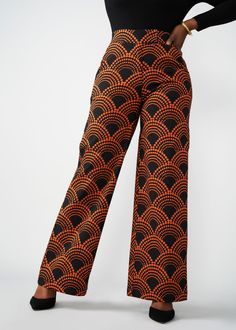 Style#: 4029/P4029 The Thema wide-leg African-print pants are an absolute #DiyanuTribe must! The bold Black Amber Dots print is paired with just the right amount of stretch for work or play and features a wide leg that's flattering on all. Features: Stretch Woven Wide Leg Pants Waist Band with Elastic 2 Side Pockets at Hip Fly Front Zipper with Hook and Eye Closure 72% Rayon/24% Nylon/4% Spandex Inseam: 33" Care Instructions: Use mild detergent. Do not bleach. Wash and iron inside out. Machine w Stretch Black Bottoms With All Over Print, Casual Wide Leg Pants With Retro Print, Fitted Black Printed Bottoms, Fitted Printed Black Bottoms, Retro Wide Leg Printed Bottoms, Black Stretch Bottoms With All Over Print, High Waist Black Printed Bottoms, Black Printed Wide Leg Pants, Fitted Wide Leg Pants With Retro Print