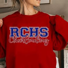 Custom Glitter Cheerleading SweatShirts and Hoodies - **Please Refer to the Pics** BASE- Background Color around the entire Logo PRIMARY- BIG LETTERS SECONDARY- Trim Color inside BIG Letters & word "Cheerleading" **Sweat Shirt & Hoodie  Info: 50/50 Cotton/Poly - Solid Colors 40/60 Cotton/Poly - Heather Colors 8 Oz. Tear Away Tag Pre-ShrunkPill-resistant air jet yarn Uni-Sex Sizing   **Available Sizes:     Adult - Small, Medium, Large, X-Large, 2X-Large    Youth - Small, Medium, Large & X-Large ( Winter Long Sleeve Tops For Cheerleading, Youth Cheerleading, Varsity Cheer, Cheer Spirit, Cheerleading Shirts, Cheer Squad, Cheer Coaches, Big Letters, Squad Shirt