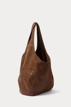 Oversized, unstructured hobo bag with a large top handle, in soft leather. 100% Leather Interior Pocket Length: 12” Width: 18” Shoulder Strap: 20" Shoulder Strap Drop: 14.5" Made in Peru Hobo Tote Bag, Womens Designer Bags, Tall Leather Boots, Tote Bag Pattern, Rachel Comey, Bag Dress, Leather Hobo, Womens Tote, Black Patent Leather