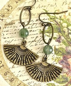 Bronze Fan and Jade Green Bead Dangle Earrings. Enjoy~ *purchase multiple items and save on shipping!!! 2+ pair = $3.98 shipping 5+ pair = FREE shipping Please visit my store to check out all of my items: http://stores.ebay.com/LOVEbeadsboutique Beaded Metal Dangle Earrings, Spiritual Beaded Drop Earrings For Gift, Metal Beaded Earrings As Gift, Adjustable Beaded Earrings For Gifts, Adjustable Dangle Crystal Earrings, Vintage Beaded Dangle Earrings, Spiritual Beaded Earrings With Dangling Beads As Gift, Metal Drop Earrings With Beaded Ear Wire, Pierced Metal Dangle Beaded Earrings