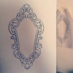 a drawing of a mirror on the wall