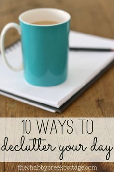 a blue cup sitting on top of a notebook with the words, 10 ways to fill it