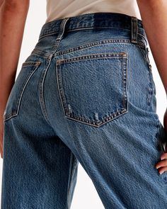 Step into the nostalgia of the early 2000s with Abercrombie & Fitch's Women's High Rise Loose Jeans. These jeans are a modern twist on a classic style, perfect for those who value both comfort and fashion.

- Size: 30 X-SHORT
- Color: Dark with Raw Hem
- Material: Body - Cotton, Lyocell; Pocket Bag - Various materials
- Gender: Female
- Fit: High rise (10.5” rise), relaxed at the waist and hips, loose full-length leg
- Features: Lightweight rigid denim, super soft authentic cotton fabric with no Everyday Distressed Cropped Leg Bottoms, Everyday Distressed Cropped Bottoms, Distressed Dark Wash Cropped Jeans In Rigid Denim, Everyday Distressed Dark Wash Bottoms, Classic Flare Jeans With Frayed Hem For Everyday, Everyday Medium Wash Cutoff Flare Jeans, Classic High Rise Medium Wash Bottoms, Classic Denim Blue Flare Jeans With Frayed Hem, Classic Flare Jeans In Denim Blue With Frayed Hem