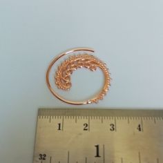 Indian style sterling silver spiral ear hoops. These are dipped in rose gold. Dimensions: 25 mm x 26 mm Price listed is for a pair. These earrings are made of 925 hypoallergenic sterling silver and rose gold All my pieces are sent in a gift box. I can include a personal message from you if needed. You are welcome to contact me at... bhavnakwintra1956@gmail.com More hoops: https://www.etsy.com/your/shops/TheSilverGame/tools/listings/section:26305414 More earrings: https://www.etsy.com/your/shops/ Delicate Rose Gold Pierced Hoop Earrings, Dainty Rose Gold Cartilage Earrings With Ear Wire, Handmade Dainty Rose Gold Hoop Earrings, Bohemian Rose Gold Jewelry With Ear Wire, Bohemian Rose Gold Earrings With Ear Wire, Rose Gold Sterling Silver Cartilage Earrings With Ear Wire, Rose Gold Wire Wrapped Hoop Earrings, Rose Gold Hoop Cartilage Earrings, Rose Gold Spiral Earrings With Ear Wire