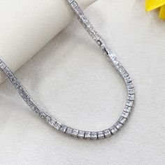 SKU : HBHB14N5004A This Simulated Diamond Necklace, Sterling Silver Necklace for Women Men, Princess CZ Stone Tennis Necklace, Tennis Chain Choker Necklace, 17" is a meticulously crafted and beautiful necklace. Specifications Metal color: 925 Sterling Silver Stone Color: Clear Stone Shape: Princess Stone Size: Available in 3 mm and 4 mm Chain: 17" Material: 925 Sterling Silver Our stones are the highest quality diamond simulants that are polished, finely cut, loupe clean, and have an exactly sim Silver Necklace For Women, Tennis Chain, Diamond Simulant, Tennis Necklace, Chain Choker Necklace, Clear Stone, Beautiful Necklace, Necklace Sterling Silver, Chain Choker