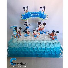 a mickey mouse birthday cake with blue icing