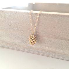 "Gold Necklace, Gold Pinecone Necklace Dainty Gold Necklace Best Friend Gift Birthday Gift Bridesmaid gift, BUZZFEED, Rustic Wedding ♥AS SEEN ON BUZZFEED!! My best selling dainty pine cone necklace ♥Did you know pinecones are the symbol of eternity & insight? A great gift for anyone!! ♥This necklace is so dainty & feminine. Wear it along or layer it with your favorite gold necklaces! ♥A delicate 14k gold filled chain, with a hint of shimmer. Adorned with a tiny gold plated pine cone pend Pine Cone Necklace, Degree Graduation, Masters Graduation, Pinecone Necklace, Floating Diamond Necklace, Bridesmaid Necklace Gift, Master Degree, Delicate Gold Necklace, Sister Necklace