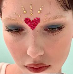 rhinestone makeup Sparkly Makeup With Jewels, Makeup Gem Looks, Halloween Gem Makeup, Gold Gem Makeup, Heart Gem Makeup, Gem Makeup Looks, Makeup Looks With Gems, Heart Makeup Look, Cupid Makeup