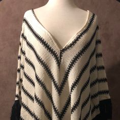 Nwt Warm And Flirty, Black And White Poncho With Fringe From Moon Collection La 74% Colton, 22% Polyester, 4% Spandex 29" Across Chest 27" Length Including Fringe Chic White Batwing Sleeve Sweater, Black Poncho For Summer, Black Long Sleeve Poncho For Beach, Black Long Sleeve Beach Poncho, White V-neck Sweater One Size Fits All, White One-size V-neck Sweater, One Size White V-neck Sweater, White One Size V-neck Sweater, Casual White Knit Poncho