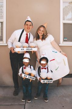 a family dressed up in costumes posing for a photo with ice cream cones on their heads