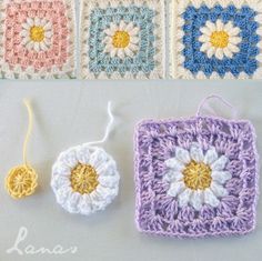 three crocheted squares with flowers on them