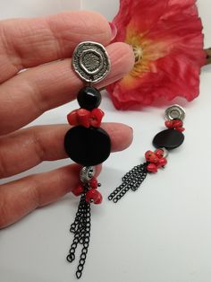 Beautiful very long earrings, created from various materials in red and black: red coral, black agate, resin elements, aluminum chain. The earrings are important and eye-catching, but at the same time they are light and comfortable to wear. The contrast between black and red make these earrings very elegant, very beautiful in summer with a low-cut dress. They recall the sea, the sun... for those who love nature. A beautiful gift for her. All jewels are delivered in a decorated box, ready to be given as a gift to your loved one. How to take care of your jewellery: put on your beauty products (cosmetics, perfumes, ...) before wearing your precious jewel. Clean your jewelry with a soft cloth after wearing. Don't use water. Make sure you store your jewelry separately to avoid scratching it. St Black Beads Dangle Earrings Gift, Black Beaded Dangle Earrings Gift, Black Beaded Dangle Earrings For Gifts, Handmade Red Coral Dangle Jewelry, Red Natural Stone Drop Earrings, Red Natural Stones Drop Earrings, Red And Black Beaded Drop Earrings, Black Natural Stones Drop Earrings, Red Earrings With Black Beads As Gift