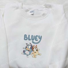 Bluey And Bingo Sisters Embroidered Shirt Are you searching for a unique and heartwarming gift for a loved one or simply want to add a touch of whimsy to your own wardrobe? Look no further than Tinicloset, your one-stop shop for the most enchanting embroidered apparel. Our collection boasts an array of stunning designs, featuring beloved Disney characters and captivating cartoons, all brought to life through intricate embroidery. One of our most cherished pieces is the Bluey And Bingo Sisters em Blue Long Sleeve Top For Gift, Blue Long Sleeve Top As Gift, Blue Long Sleeve Top As A Gift, Blue Long Sleeve T-shirt For Gift, Blue Long Sleeve T-shirt As Gift, Blue Cotton Tops For Gifts, Blue Cotton Tops As A Gift, Blue Cotton Top As A Gift, Australian Heeler