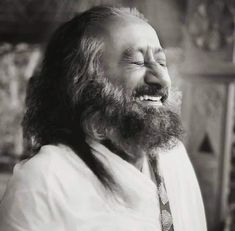 a man with long hair and beard smiling