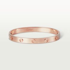 Cartier - LOVE bracelet - Bracelet Gold - LOVE bracelet, 18K rose gold (750/1000). Comes with a screwdriver. Width: 6.1 mm. Created in New York in 1969, the LOVE bracelet is an icon of jewelry design: a close fitting, oval bracelet composed of two rigid arcs which is worn on the wrist and removed using a specific screwdriver. The closure is designed with two functional screws placed on either side of the bracelet: you will need help to open or close it. To determine the size of your LOVE bracele Bracelet Cartier, Bracelet Rose Gold, The Bangles, Cartier Bracelet, Luxury Bracelet, Bracelet Love, Detailed Jewelry, Love Bracelet, Simple Bracelets