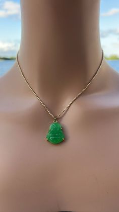 This necklace is perfect for those that love dainty jewelry and small charms . Information: ✨ Genuine green Jade stone, carved with the image of the laughing Buddha. ✨ Tarnish resistant: please avoid contact with lotions, perfumes and frequent showers. Buddha's are known for their ability to attract peace and wealth to the wearer, a simple scratch in the belly can set your intentions for the necklace. This necklace makes a perfect gift, especially for someone seeking more abundance into their life's. Buddha Jade Necklace, Jade Stone Necklace, Green Pendant Jewelry With Delicate Chain, Jade Necklace With Lobster Clasp As A Gift, Green Crystal Pendant Necklace With Adjustable Chain, Jade Necklace With Lobster Clasp For Gift, Green Pendant Crystal Necklace With Adjustable Chain, Green Pendant Necklace With Delicate Chain, Green Pendant Charm Necklace With Adjustable Chain