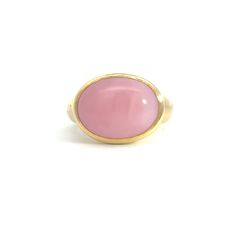 Elevate your style with the stunning Large Oval Cabochon Gumdrop Ring, a true statement piece crafted from luxurious 18K gold. This eye-catching ring features a magnificent 5.44-carat oval cabochon gemstone that radiates with vibrant color and unparalleled clarity.The smooth, polished surface of the cabochon is perfectly complemented by the rich, gleaming gold band, creating a harmonious blend of sophistication and bold elegance. The gumdrop setting adds a playful touch to this timeless design, ensuring the gemstone remains the star of the show while providing a secure and stylish fit.Whether you're dressing up for a special occasion or looking to add a pop of color to your everyday ensemble, the Large Oval Cabochon Gumdrop Ring is sure to turn heads and spark conversations. Slip it on and Yellow Gold Moonstone Ring With Polished Oval Cabochon, Yellow Gold Oval Cabochon Moonstone Ring, Yellow Gold Moonstone Ring With Oval Cabochon, High Luster Oval Ring In 14k Gold, 14k Yellow Gold Dome Ring With Oval Cabochon, High Luster 14k Gold Oval Rings, Elegant 14k Gold Cabochon Moonstone Ring, Fine Jewelry Yellow Gold Oval Cabochon Moonstone Ring, Fine Jewelry Yellow Gold Dome Ring With Cabochon