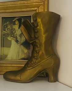 Vintage Victorian Style Brass Boot Ornament. These type of brass ladies booties are steeped in custom, symbolic meaning and stories, such as Cinderella and Dorothy. These shoes were historically offered as gifts on special occasions in the 17th and 18th centuries - often exchanged between lovers as a symbol of good luck in marriage.  They were either made as ornaments, gifts, or vases. I own several brass boot vases, and this is my favorite. I love the detail put into each "button" and it is more realistic looking than all others.  It measures 9.5" in height and weighs a sturdy 2.5 pounds.  Made in Korea and manufactured by Leonard Solid Brass Co.  ꧁I ship from Central Florida NEXT DAY (excluding Sunday and Federal holidays) on every purchase.  ꧁ I'm quite experienced at packing and protec Boot Ornament, Vintage Victorian, Victorian Style, Victorian Fashion, Collectible Figurines, Good Luck, Cinderella, Patina, Figurines