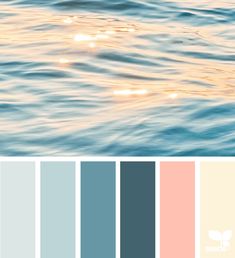 the color palette is blue, pink, and white with some light reflecting on the water