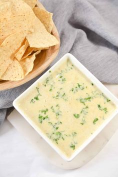 a bowl of quesadilla dip with tortilla chips on the side