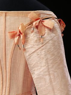 1660. Perhaps the most interesting use of ribbon during the 17th century, however, was the ribbon loop. Developed out of the bows and loose rosettes, by the 1650s, these loops became the mark of the most fashionable, Cavalier gentleman. Cascades of these rustling ribbon loops were hung low around the waist to bridge the gap between relatively short doublet and high-waisted breeches. 1600 Fashion, Peach Cottage, Feeling Peachy, 17th Century Clothing, 17th Century Fashion, Peach Tree, Peach Cake, Shades Of Peach, Peachy Keen