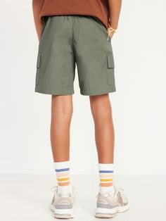 elasticized waistband functional drawstring faux fly diagonal on-seam pockets flap-cargo pockets easy pull-on style sits at waist relaxed through hip and thigh hits above kneemachine wash according to the care instruction label Shorts Cargo, Cargo Joggers, Jogger Shorts, Hush Puppies, Rip Curl, Above Knee, Old Navy, Navy